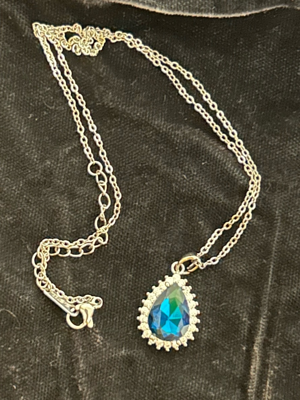Silver Tone Necklace with Blue Teardrop Pendant and Crystal Halo